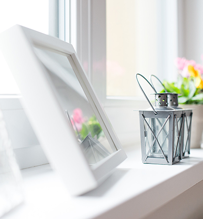 close up image of a window sill with photo frame